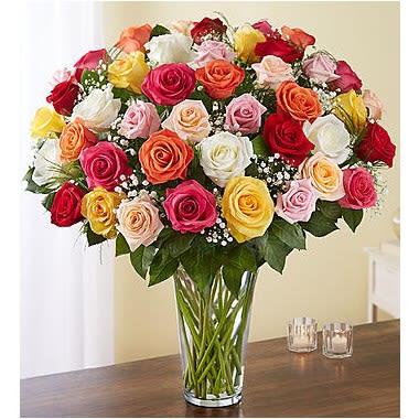 Ultimate Elegance™ Long Stem 50 Assorted Roses - Our rainbow of long-stem roses is the ultimate surprise for letting someone know how you feel. 60 blooms in a stunning array of colors are artistically arranged by our expert florists inside an elegant glass vase and personally hand-delivered to help you beautifully express what’s in your heart. All-around arrangement with 60 long-stem multicolor roses; accented with baby’s breath and assorted greenery Our florists select the freshest flowers available, so the shade of the rose may vary due to local availability Artistically arranged in a classic clear glass vase 60-stem arrangement measures approximately 23"H x 18"L