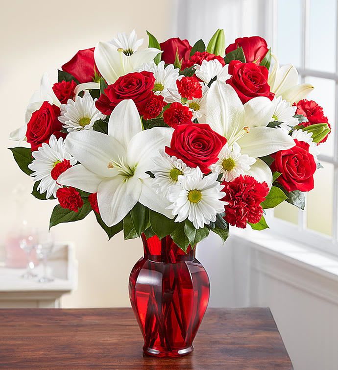 Red &amp; White Delight - EXCLUSIVE Delight them with red &amp; white. Our radiant new bouquet is a beautiful surprise for the one you love. Filled with lush blooms in classic romantic colors, this hand-gathered arrangement arrives in a striking ruby red vase, creating a memorable gift for an anniversary, or the everyday moments you want to hold onto forever.
