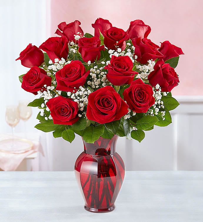 Love You Always 18 Red Roses in Red Vase - Love them with roses today and always. No matter what occasion you can always enjoy our long lasting premium long stem roses in a red passion glass vase.