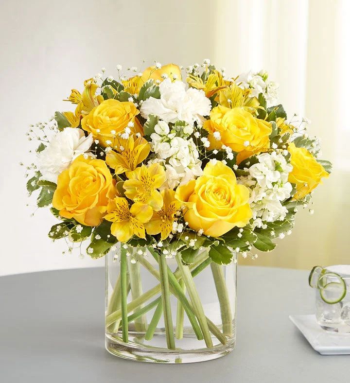 Yellow &amp; White Delight Bouquet - Spread sunshine and happiness with our stunning bouquet! Bursting with radiant yellow and white flowers, this arrangement will surely bring a smile to their face. Lush greenery adds a touch of vibrance, all presented in a clear vase. Send warm sentiments to your special someone with this delightful bouquet.