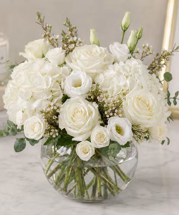 Hydrangea and White Roses Bowl - Rounded bowl of white roses, hydrangeas, and lisianthus in a clear glass vase with soft green accents