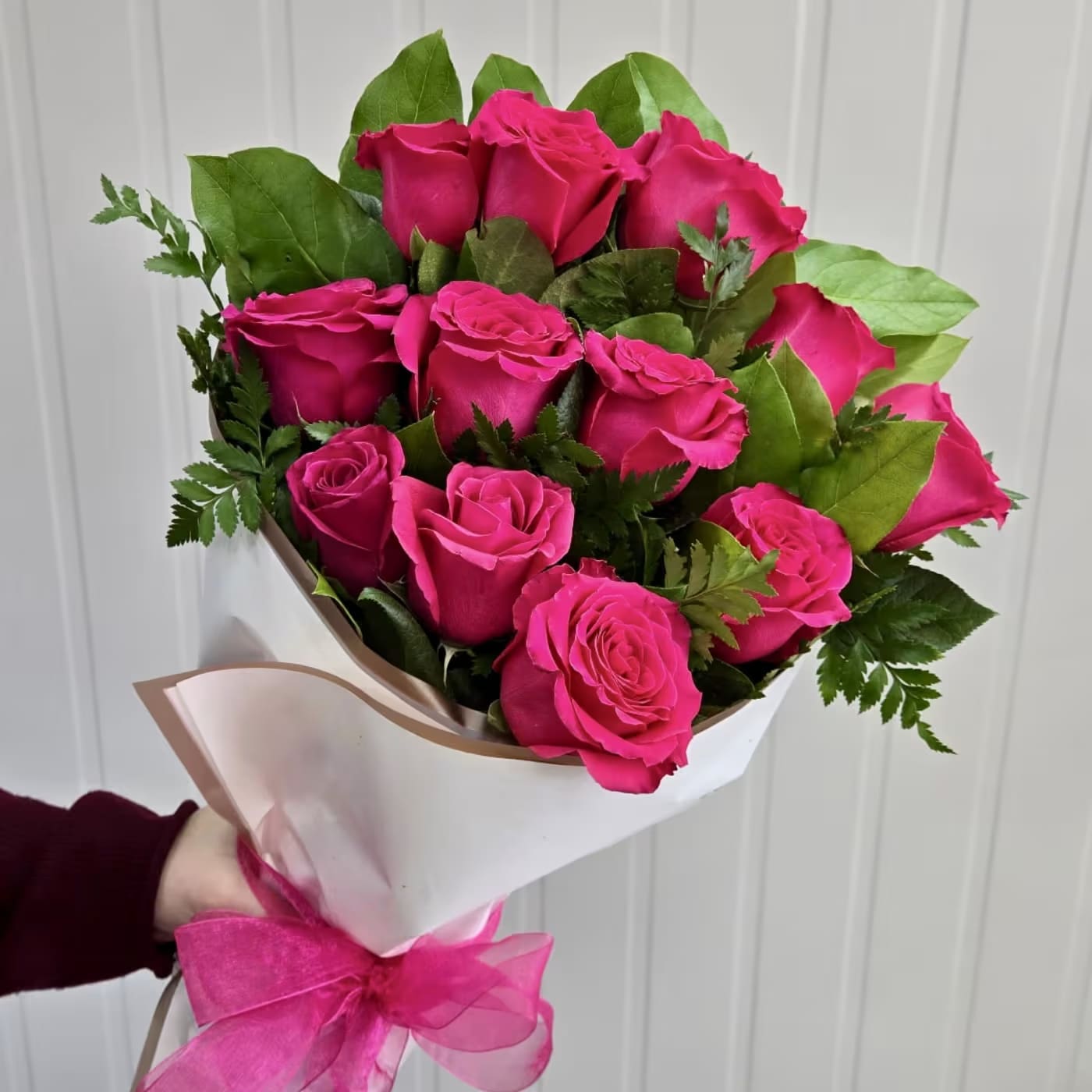 Hot Pink Long-Stemmed Dozen Roses Wrapped Bouquet - Premium Hot Pink Rose Bouquet | Fresh Roses | Same-Day Flower Delivery  Looking for the perfect way to express love, appreciation, gratitude, or admiration? Our Premium Rose Bouquet from Gallery Flower Shop is an elegant arrangement featuring 12 fresh premium roses, beautifully wrapped in luxurious white designer paper with lush greenery for a timeless and sophisticated presentation. Handcrafted by our expert floral designers, this bouquet is perfect for birthdays, anniversaries, romantic occasions, Mother's Day, Valentine's Day, graduations, congratulations, thank-you gifts, new baby celebrations, get well wishes, or simply to brighten someone's day.