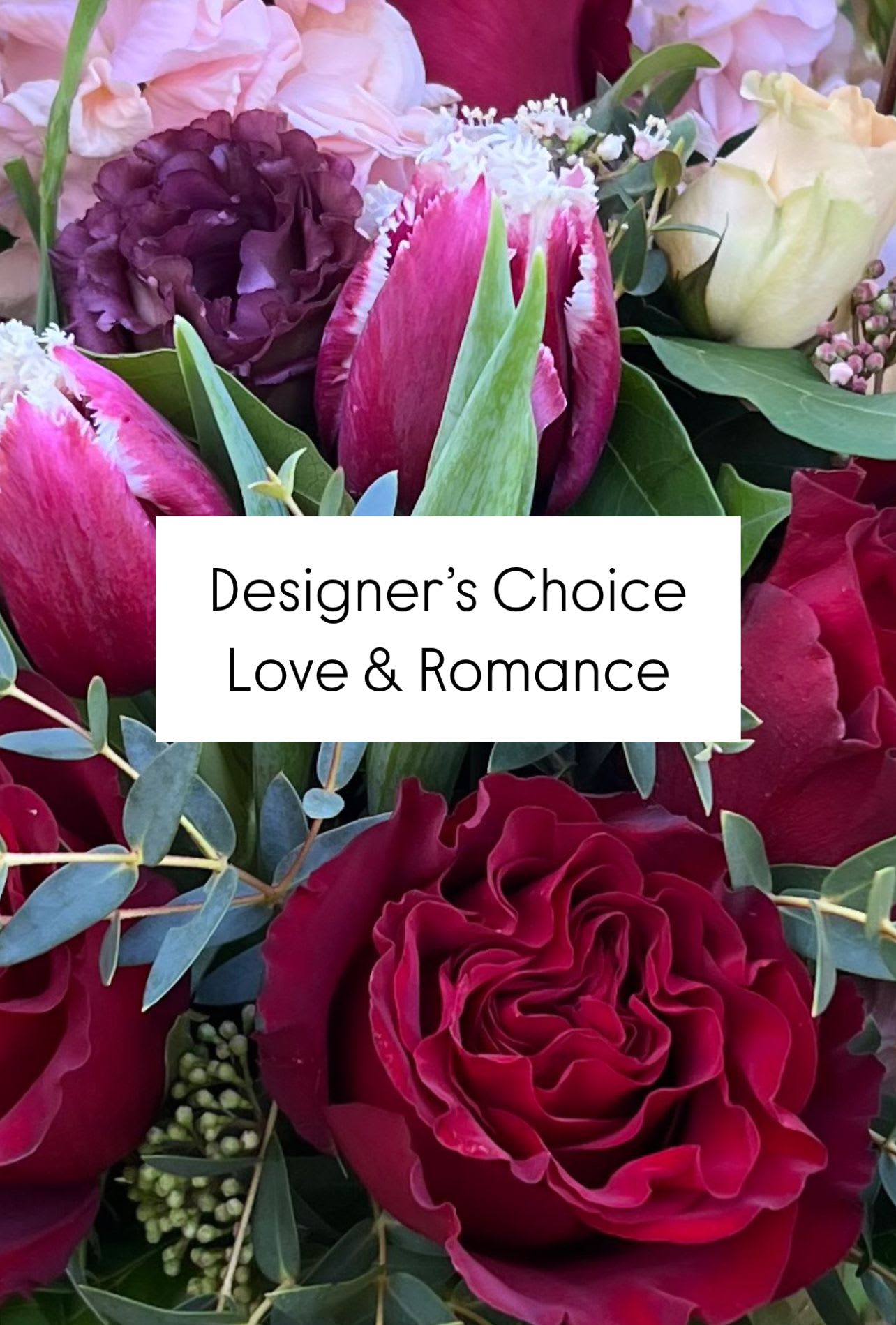 Bouquet of red and pink roses with tulips and purple blooms
