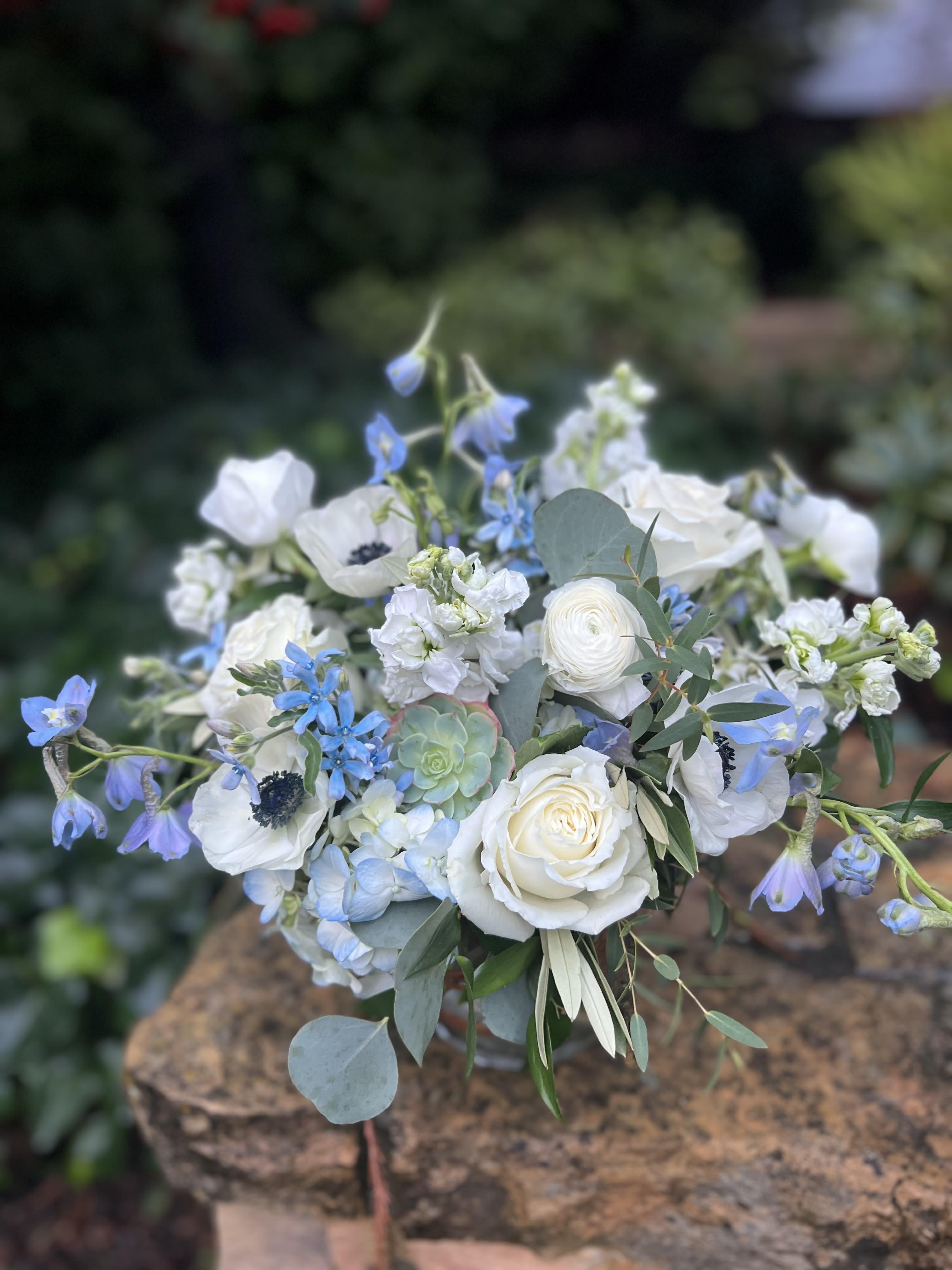 White and blue mixed bouquet with roses and ranunculus