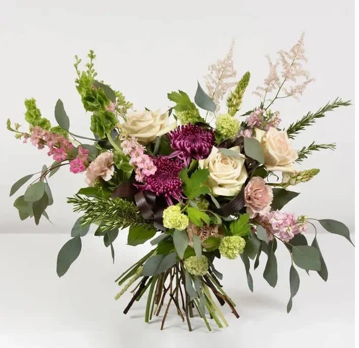 Bouquet of cream and purple flowers with airy greenery