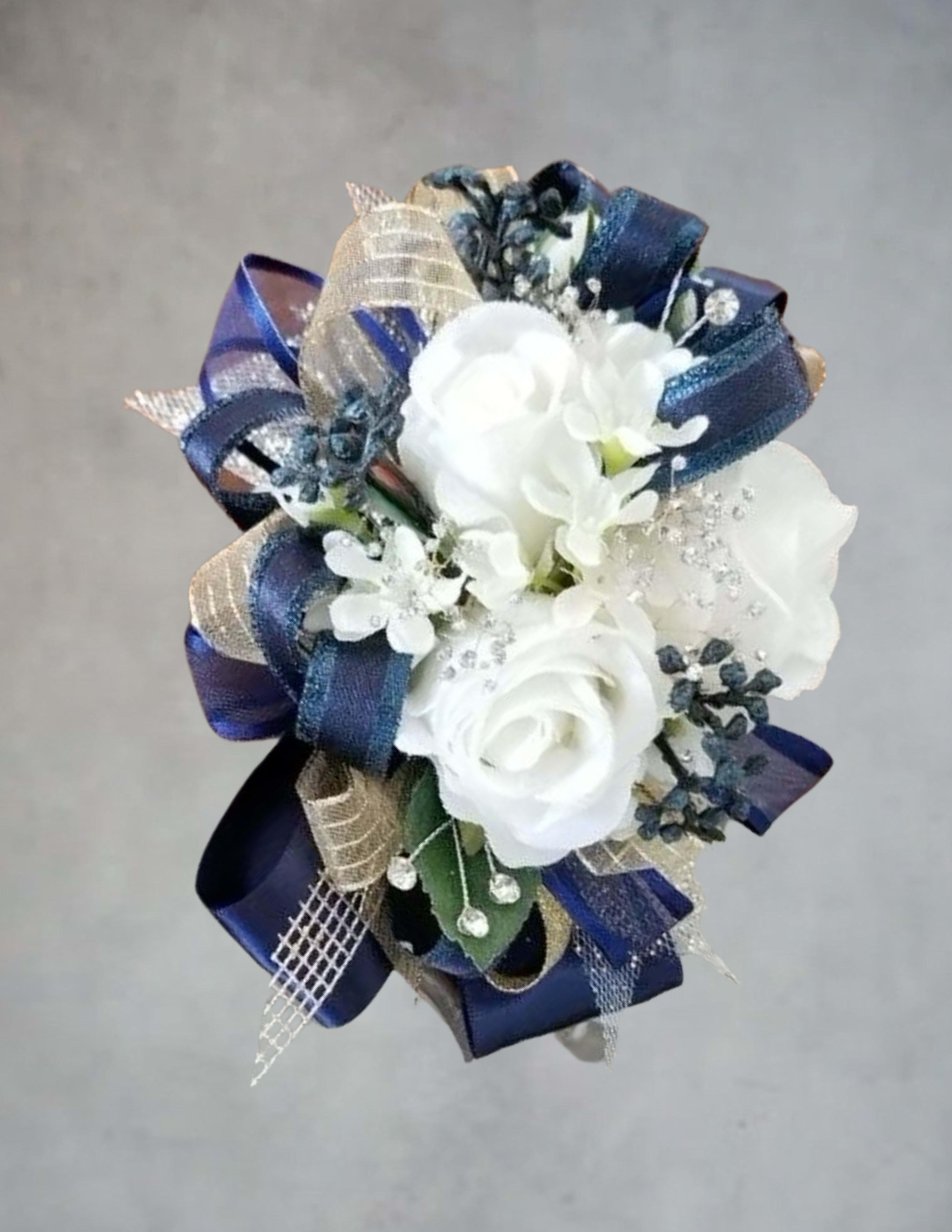 White rose bouquet with navy and gold ribbon accents