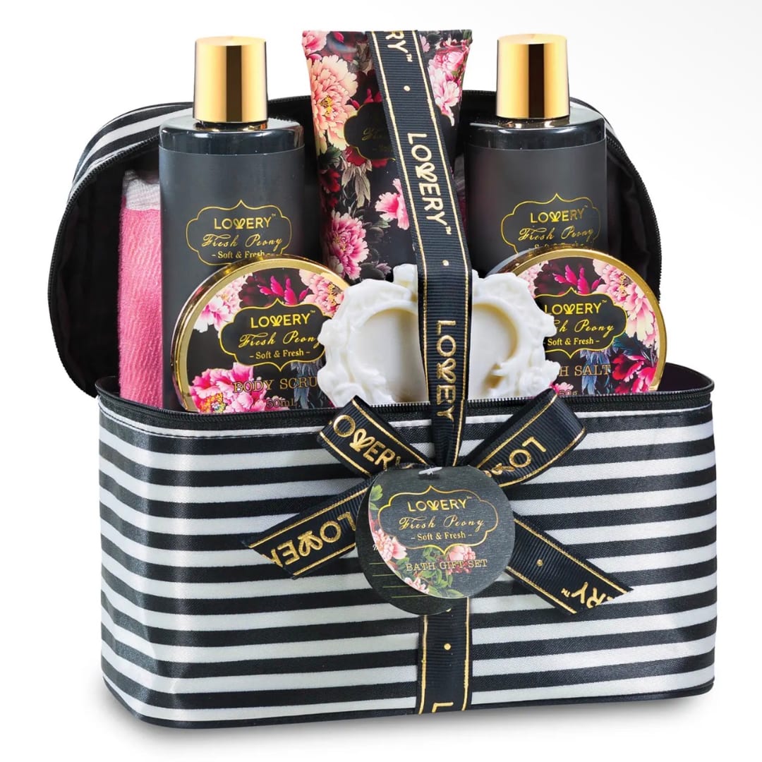 Bath gift set in a striped zippered bag with floral-labeled bottles and jars