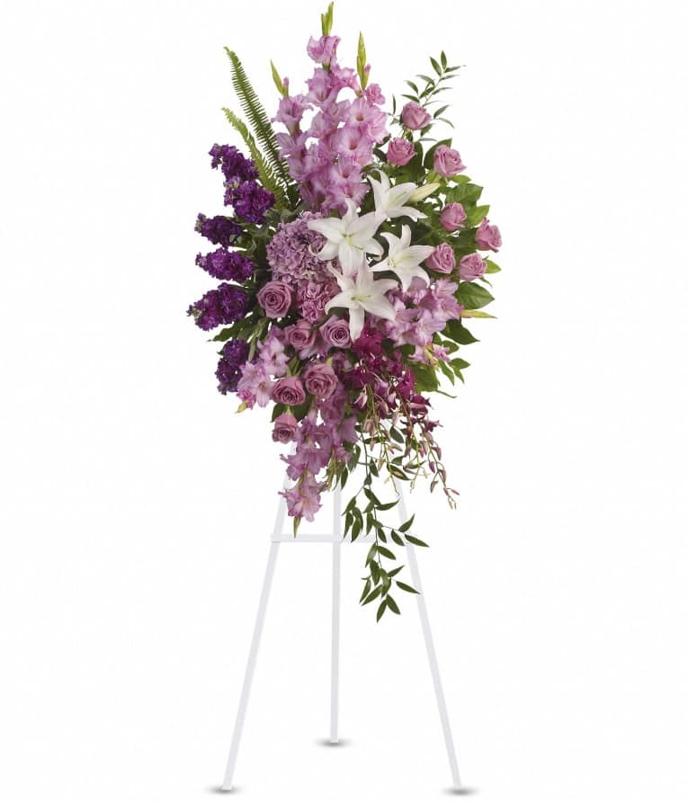 Sacred Garden Spray - A lovely lavender spray of flowers lets you share your compassion, hope and beauty with all. Beautifully simple. Beautifully serene. It's the perfect way to send your sincere sympathy. Lavender, purple and white flowers like hydrangea, orchids, roses, oriental lilies and more create a beautiful spray. A wonderful tribute. Approximately 26" W x 51" H