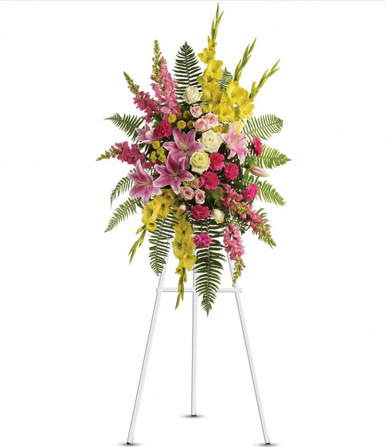 Rays of Light Spray - This stunning spray is a beautiful and touching display of your sympathy and devotion. A lovely composition of flowers such as green roses, gladioli and button spray chrysanthemums, pink spray roses and carnations, light pink oriental lilies and snapdragons are arranged with a mix of beautiful greenery in a standing spray of flowers that's delivered on an easel. Approximately 29" W x 46" H
