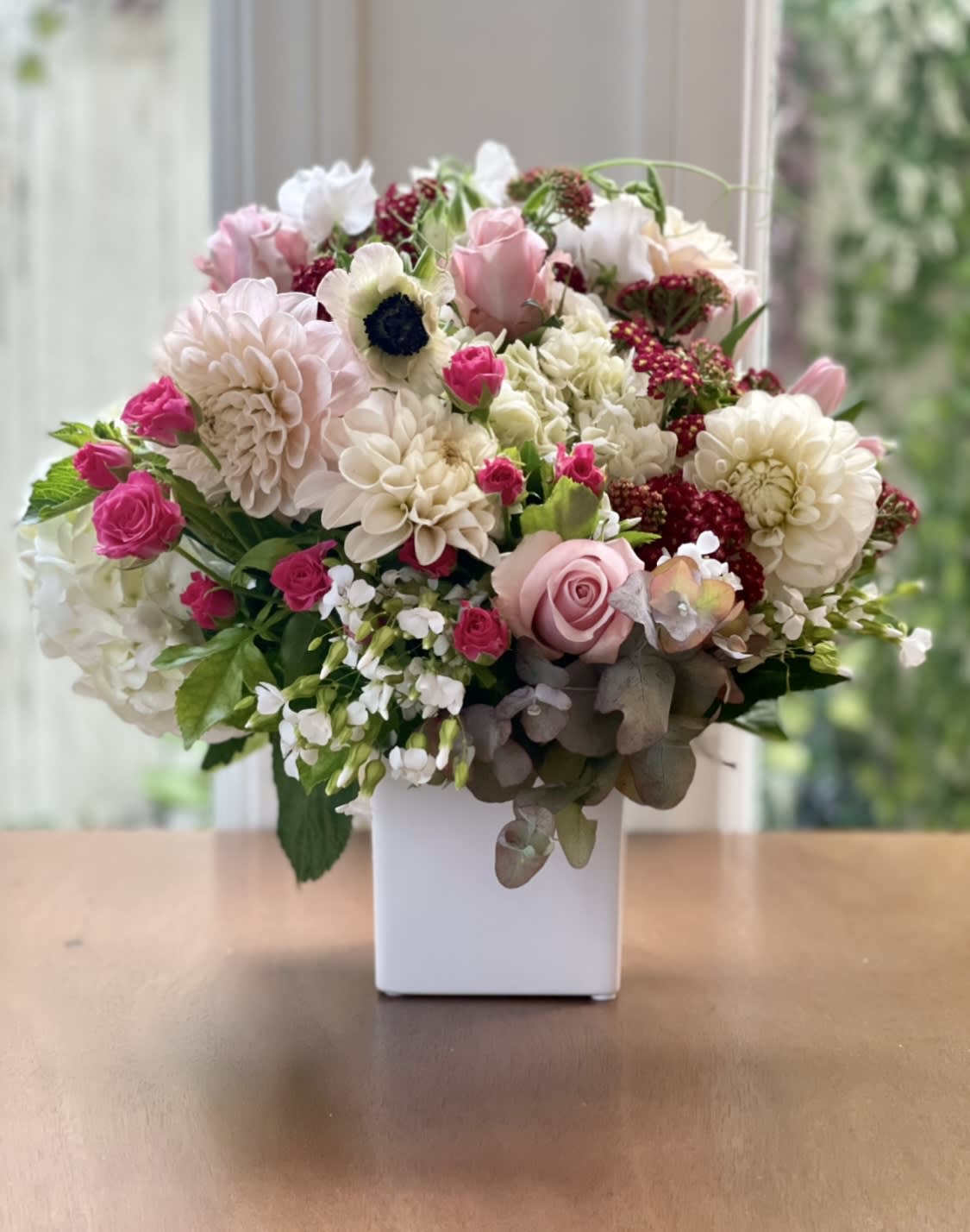 VINTAGE GARDENS - Romantic, nostalgic, and full of charm — Vintage Gardens is a garden-style arrangement of soft blush roses, ivory spray roses, tulips, Queen Anne’s lace, and textured greens, all gathered in a vintage-inspired vase.  Perfect for anniversaries, springtime gestures, or vintage-themed weddings. A best-seller for flower delivery in San Diego, especially among those searching romantic floral arrangements, vintage flower bouquets, or pastel garden-style blooms near me.