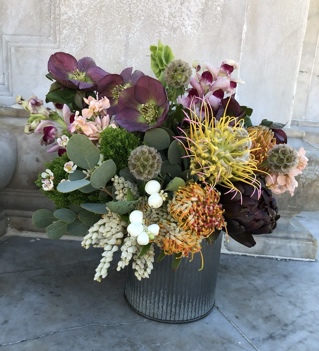 COUNTRY FLORALS  - Rustic, cheerful, and full of natural charm — Country Florals features a whimsical mix of protea, goldenrod, cymbidium orchids, and seasonal greenery. With its sun-drenched tones and loose, farm-style vibe, this arrangement feels freshly gathered from a country field.  A top pick for birthdays, housewarmings, or casual celebrations. Great for those looking for wildflower-style bouquets, farmhouse flower arrangements, or same-day rustic floral delivery in North County and beyond