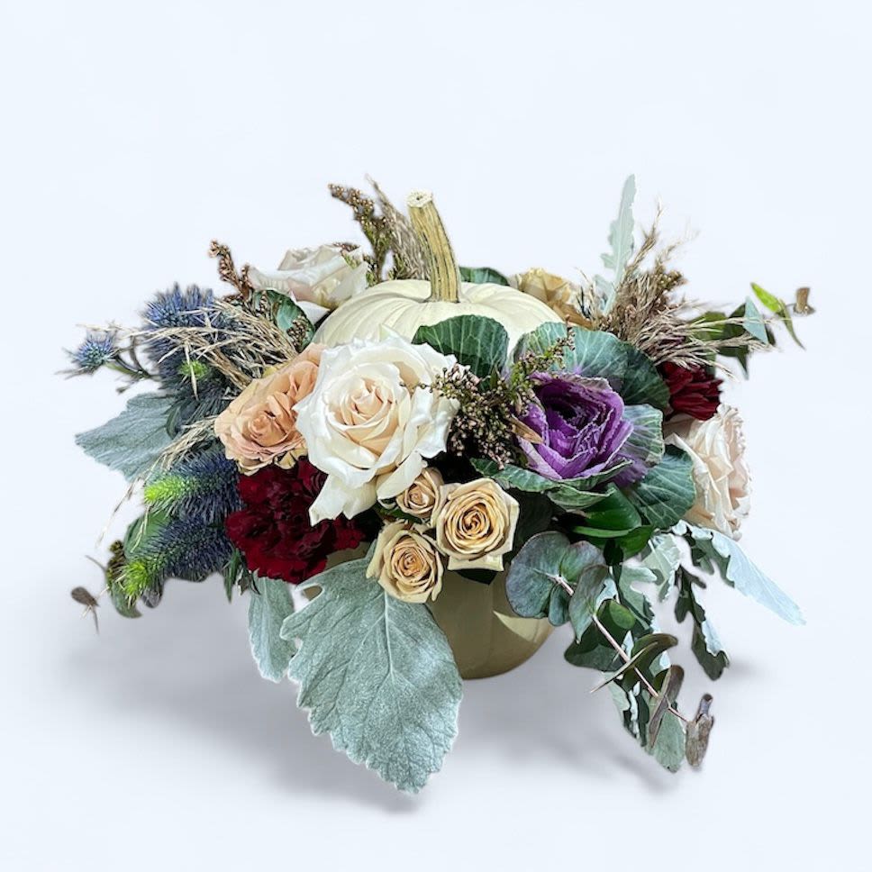 Mixed floral arrangement with a white pumpkin centerpiece