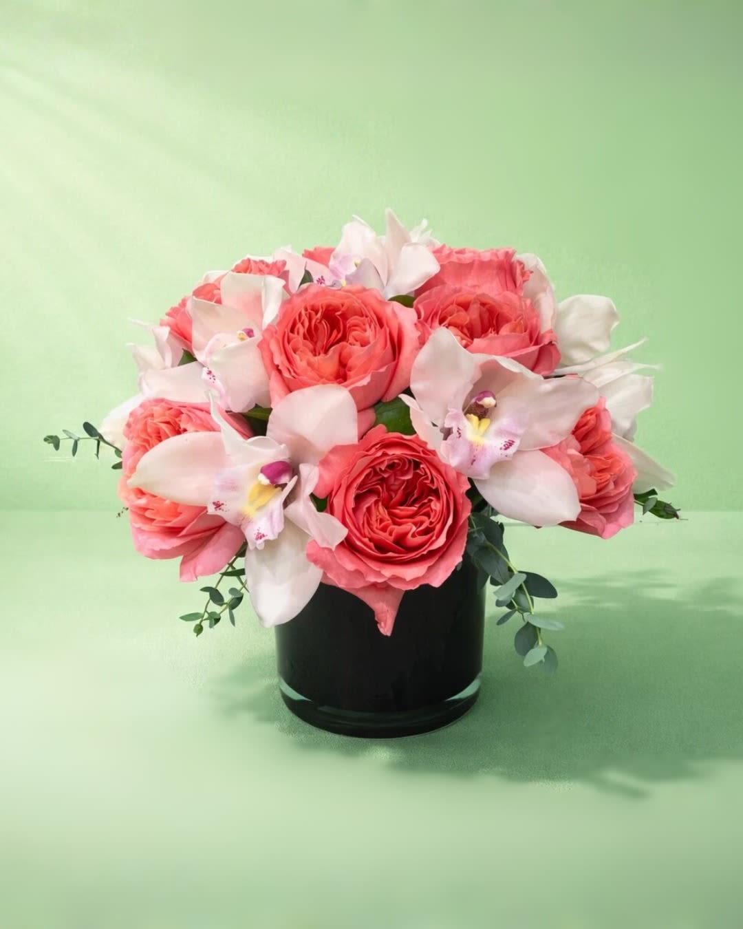 Coral Romance - Pretty pinks come together in this cheerful arrangement that's perfect for brightening someone's day.