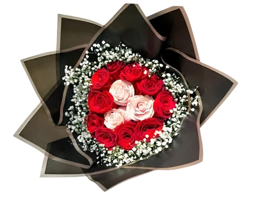 Bouquet of red and pale pink roses wrapped in dark paper