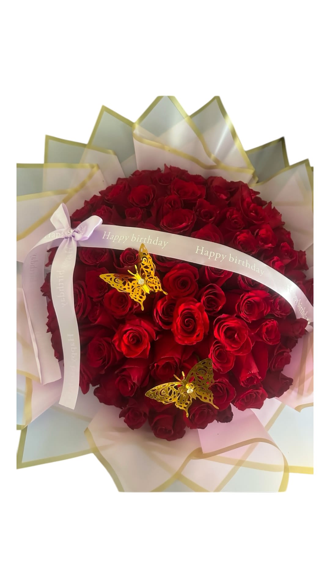 Red rose bouquet with birthday ribbon and butterfly decorations