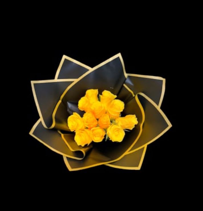 Yellow roses wrapped in black paper with gold trim