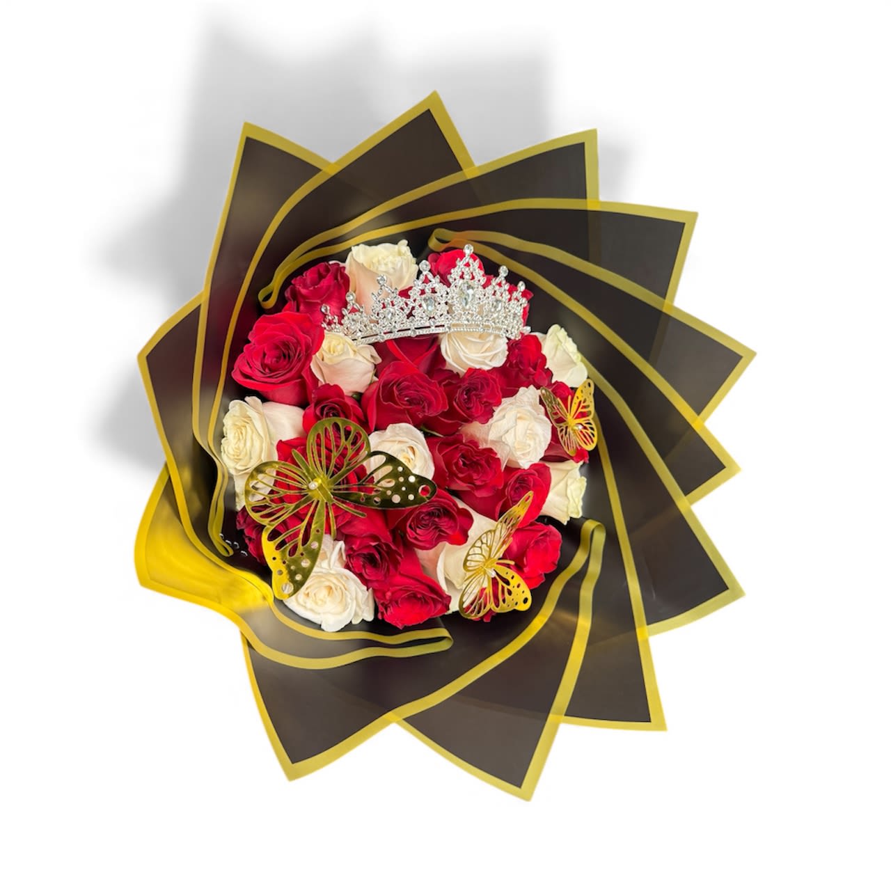 Bouquet of red and white roses with a jeweled crown and butterfly accents