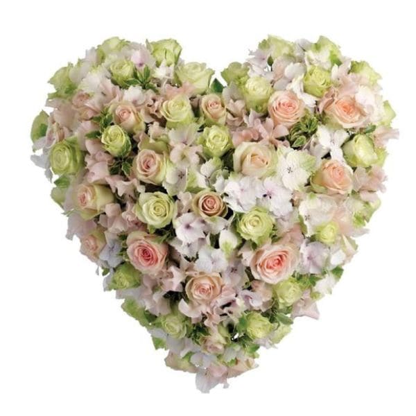 Heart-shaped bouquet of pale pink and green roses with white flowers