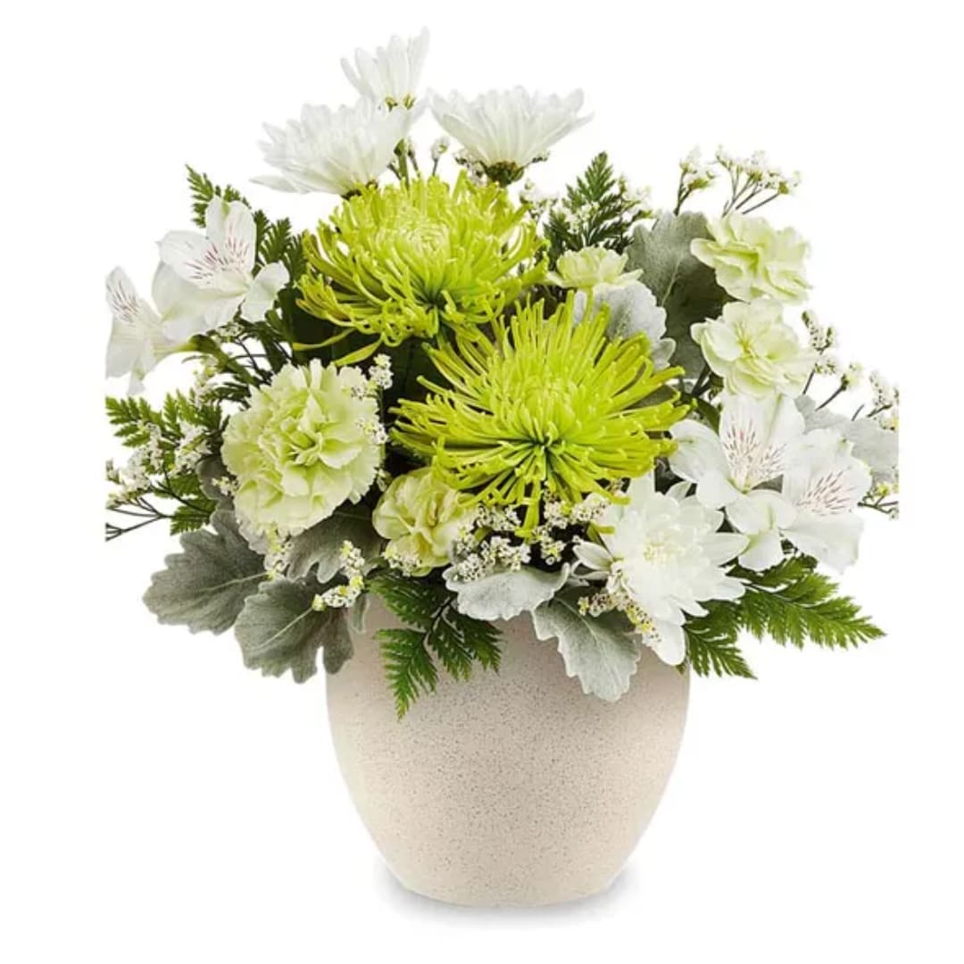 White and lime-green floral arrangement in a beige vase