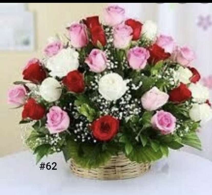 Basket arrangement of red, pink, and white roses