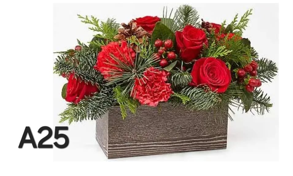 Red roses and carnations in a rectangular wooden box with evergreen accents