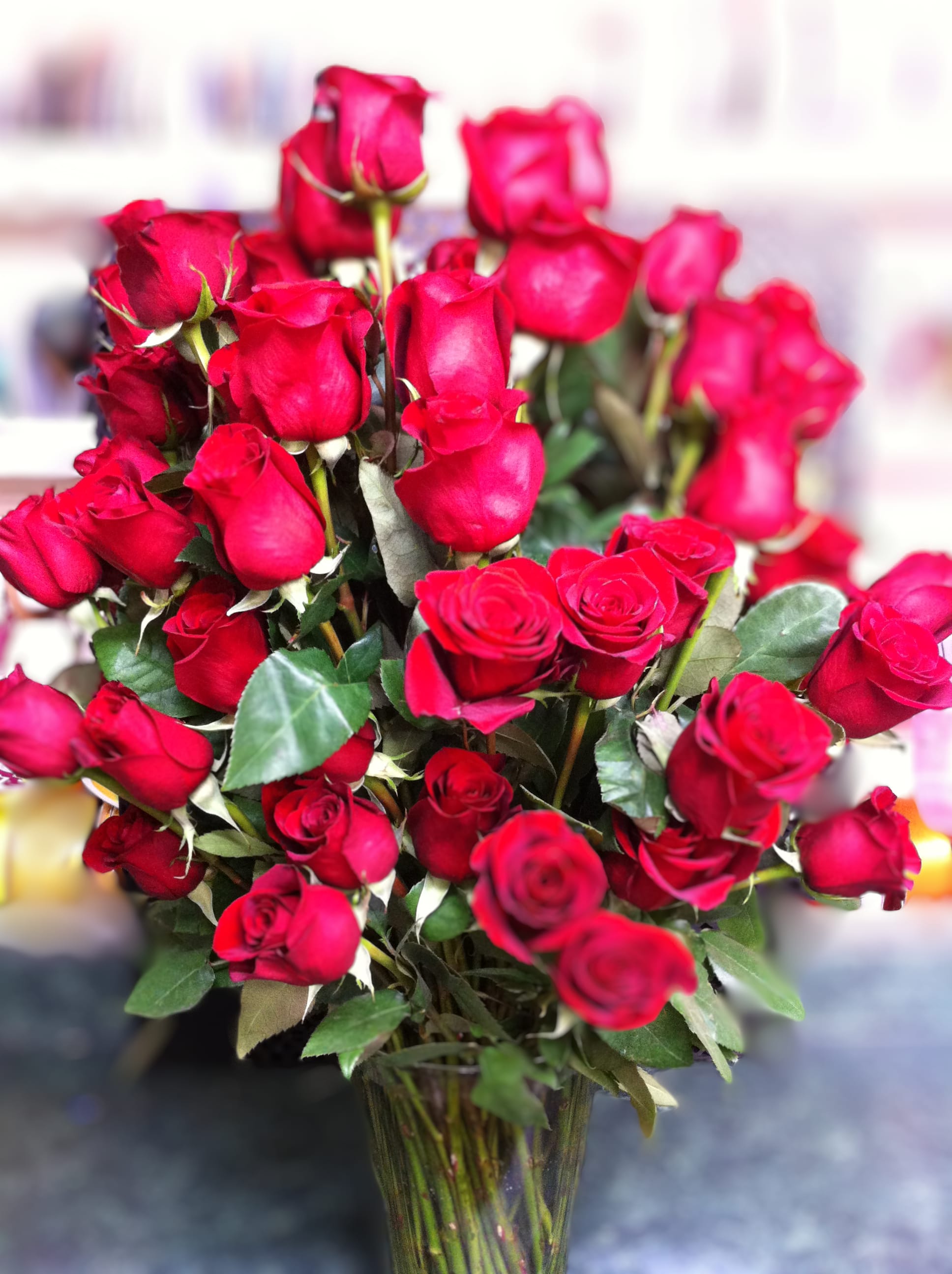Bouquet of red roses in a clear glass vase