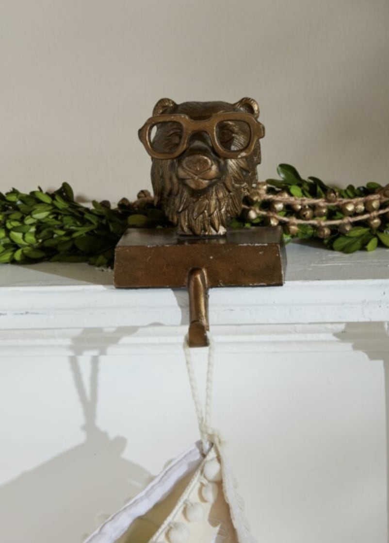 Stocking Holder Beatrice - Add a touch of charm and whimsy to your space with Beatrice the Bear, a delightful bag holder that brings a cozy, woodland vibe to any room. With her soft, rounded features and playful expression, Beatrice combines both strength and sweetness, making her the perfect companion for your home. Crafted with attention to detail and built with a sturdy base, this lovable bear is ready to hold your stocking or ornaments with reliable support. Whether you're looking for a functional accent or a unique gift, Beatrice the Bear is sure to become a treasured addition to your decor.