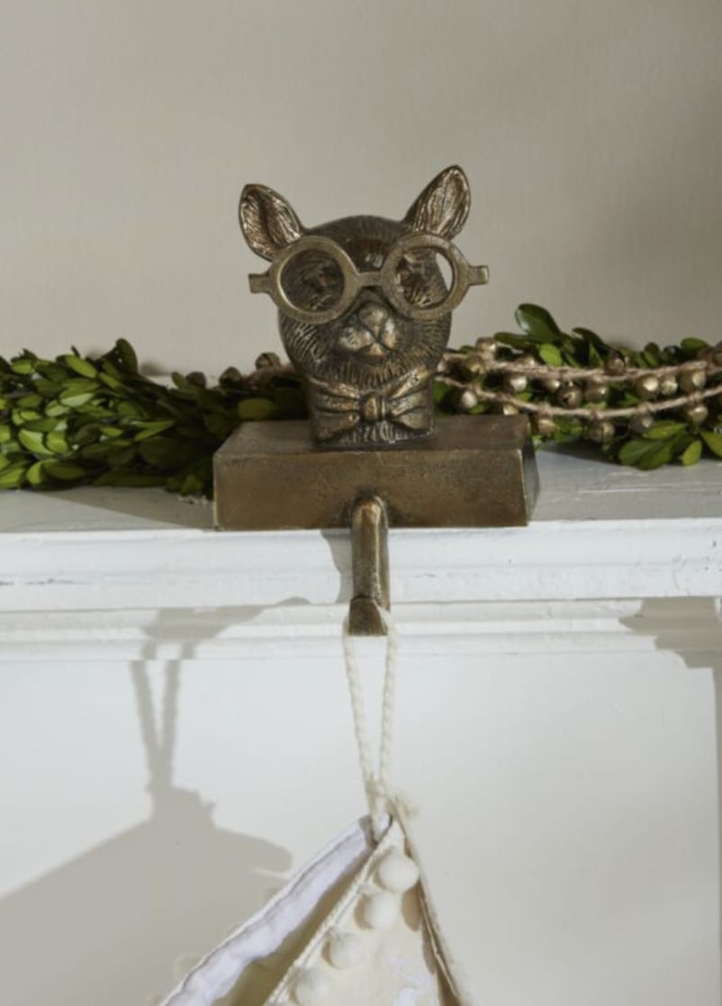 Stocking Holder Louie  - Add a touch of whimsy and sophistication to your space with Louie the Mouse, a charming stocking holder that’s as stylish as it is playful. Sporting a dapper bow tie and round glasses, Louie exudes a personality all his own—perfect for adding a little extra cheer to any room. His endearing expression and attention to detail make him a standout piece in any decor. With a sturdy base and steady design, Louie is ready to hold your stockings or ornaments with both charm and support. Whether you’re refreshing your home or looking for a unique gift, Louie the Mouse will bring delightful character to your collection.