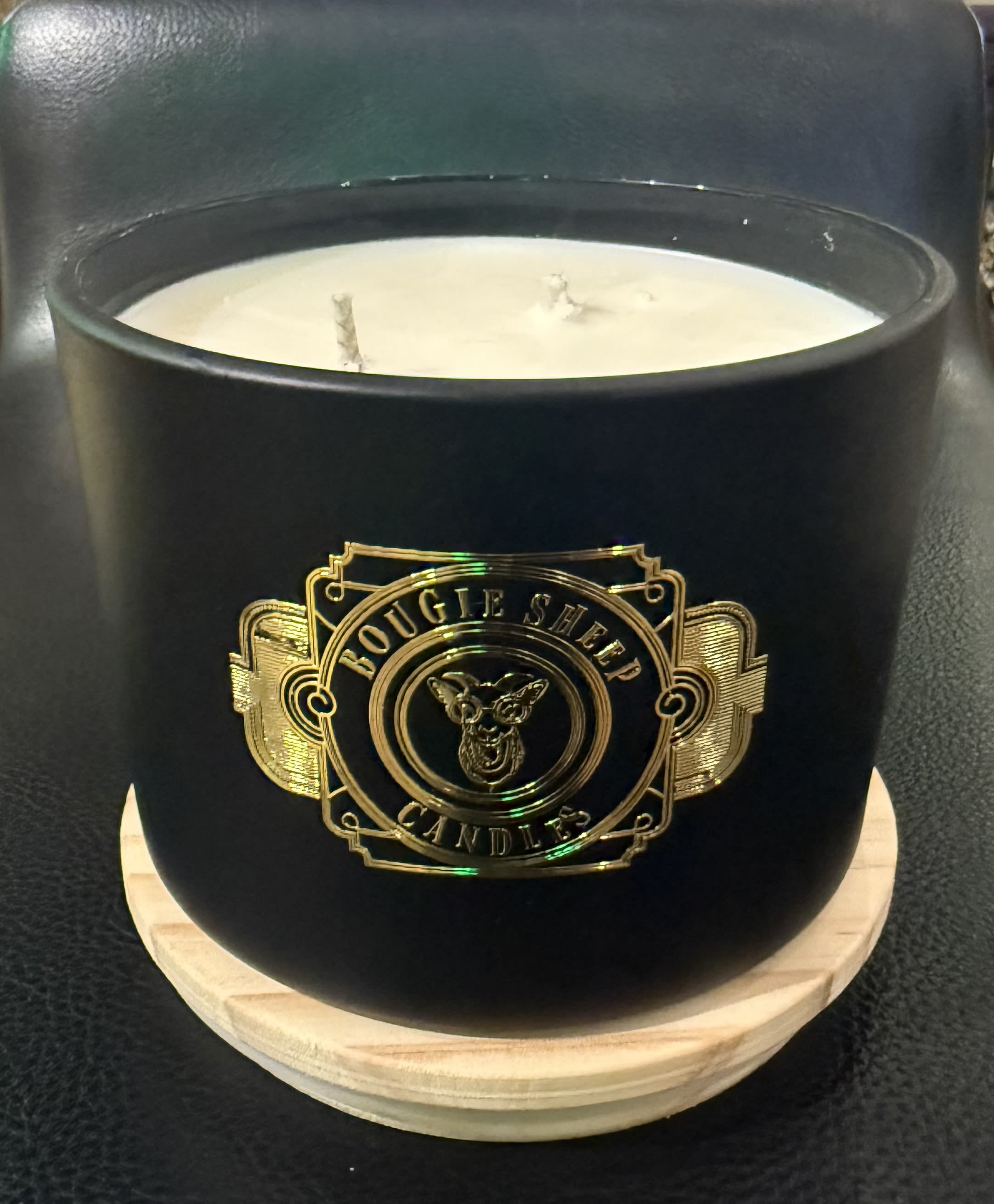 Glühwein Bougie Sheep Candle - Warm, cozy, and irresistibly charming, our Bougie Sheep 18 oz Candle returns in the beloved Glühwein scent—an inviting blend inspired by the spiced mulled wine served in European Christmas markets. With notes of warm red wine, cinnamon sticks, clove, orange peel, and a touch of holiday sweetness, this candle fills your space with the comforting aroma of winter gatherings and festive cheer.  Hand-poured in small batches and dressed in our signature Bougie Sheep style, this candle is equal parts whimsical and luxurious. Whether glowing on a holiday table, tucked into a gift box, or brightening your home through the season, it brings warmth, personality, and a touch of Chartreuse by Roje magic.  Each candle is 10 oz, sold individually, and poured with care—perfect for gifting, collecting, or savoring on a cozy winter night. Let the delightful scent of Glühwein guide you into the heart of the holidays.