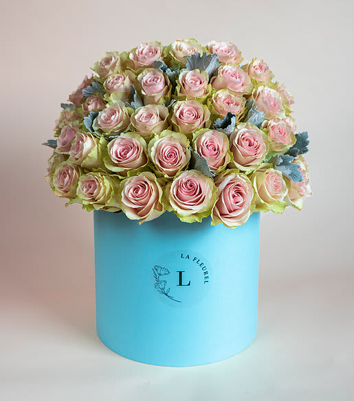 Frutteto Roses in a Tiffany Box - This beautiful box contains a combination of 45 to 50 fresh roses in a tiffany blue box. This floral arrangment is the perfect gift for your loved one!   Arrangement includes: Fresh white roses and other greens Medium box measured at 9.75" Dia. x 9.25" H Custom greeting card