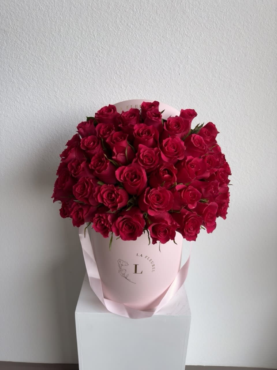 Hot Pink fuchsia roses - This beautiful arrangement filled with hot pink roses to deliver your special message to your special someone.  Perfect for any occasion. You can choose any color of the box.  Arrangement includes: fuchsia roses Medium box measured at 9.75" Dia. x 9.25" H Custom greeting card