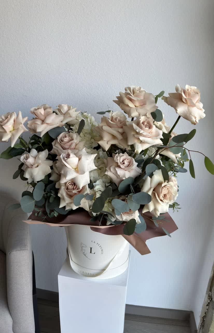 Hello Beautiful - This beautiful arrangement is filled with beige color roses and greens to deliver your special message to your special someone.  Perfect for any occasion. You can choose any color of the box.  Arrangement includes: Medium box measured at 9.75" Dia. x 9.25" H Custom greeting card