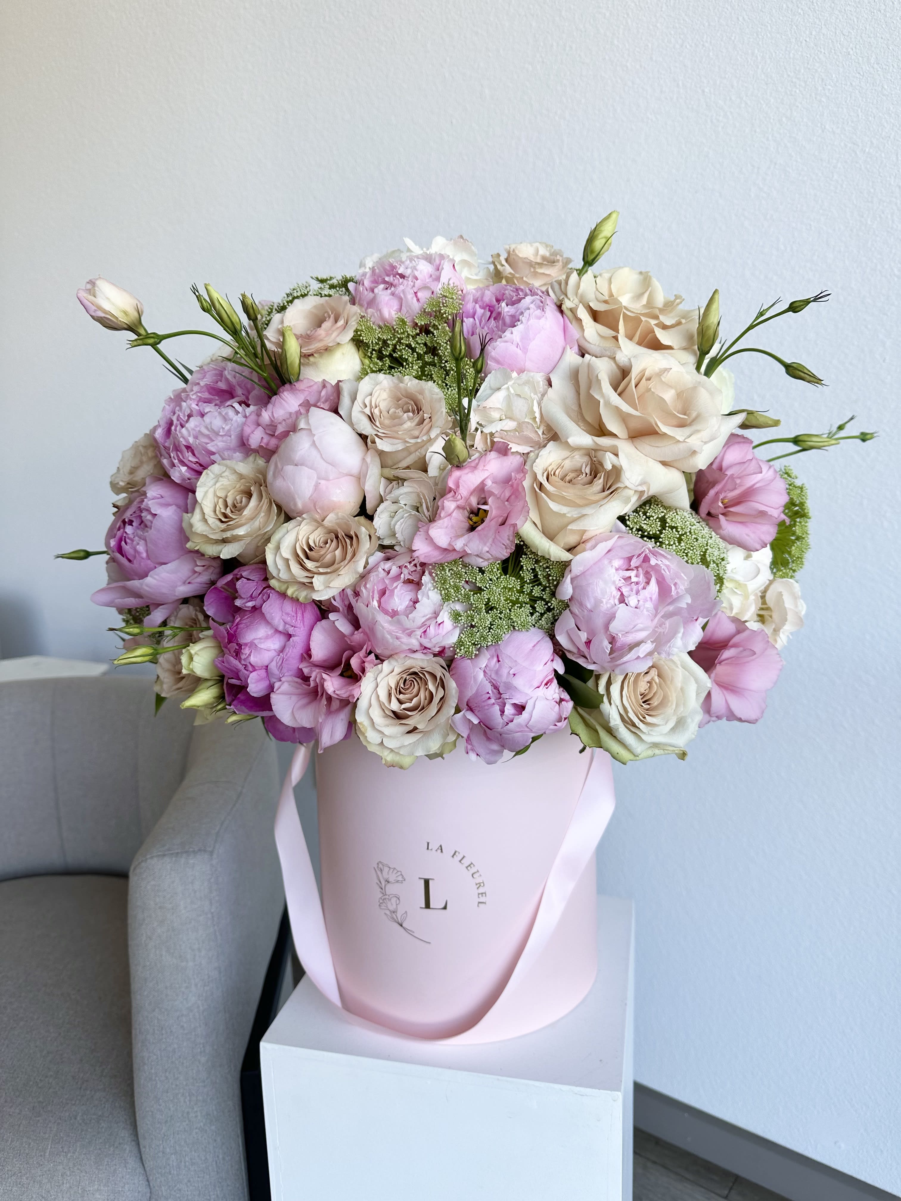 Peonies Dreams - his gorgeous arrangement filled with the peonies, roses and greens to deliver your special message to your special someone.  Perfect for any occasion. You can choose any color of the box.  Arrangement includes: Peonies, roses and greens Medium box  Custom greeting card