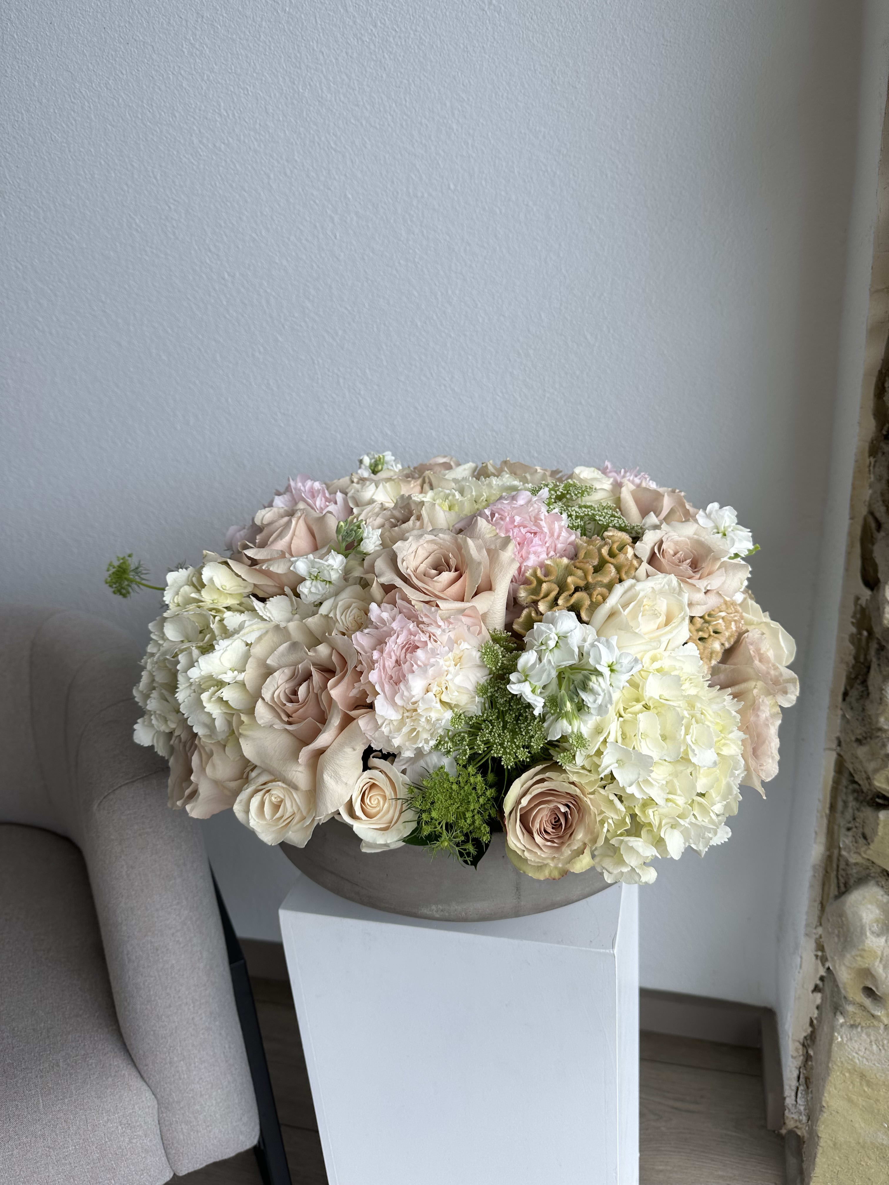 Graceful Posies - This beautiful arrangement filled with the roses, hydrangeas, peonies and greens to deliver your special message to your special someone.  Perfect for any occasion.  Arrangement includes: Large Concrete Vase  Custom greeting card 