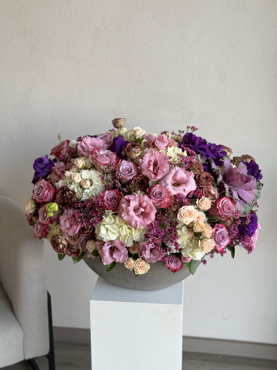 Violet Bloom Ensemble - An enchanting ensemble of various purple blooms, elegantly arranged in a clear glass vase. The Violet Bloom Ensemble is a captivating display of nature's beauty and grace.