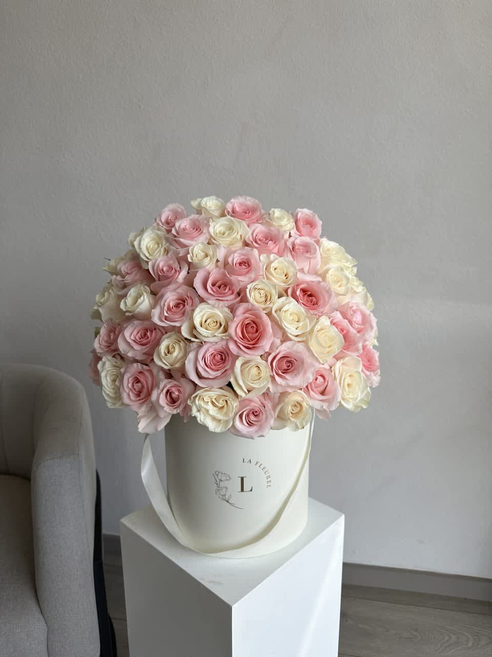 Pink and White 50 Roses - This beautiful arrangement filled with the white and pink roses to deliver your special message to your special someone.  Perfect for any occasion. You can choose any color of the box.  Arrangement includes:  Medium box measured at 9.75" Dia. x 9.25" H Custom greeting card
