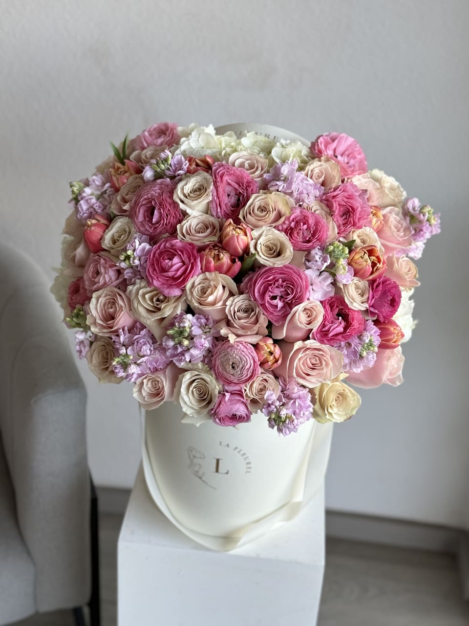Spring Grace - "Spring Grace" is a captivating floral arrangement that embodies the essence of the season with its delicate blooms and graceful presentation. Featuring a harmonious blend of fresh spring flowers such as tulips, daffodils, and hydrangeas, accented with vibrant greens, this arrangement exudes sophistication and charm. Each stem is carefully selected and artfully arranged to evoke a sense of renewal and beauty, making it the perfect centerpiece to brighten any space with its timeless elegance.