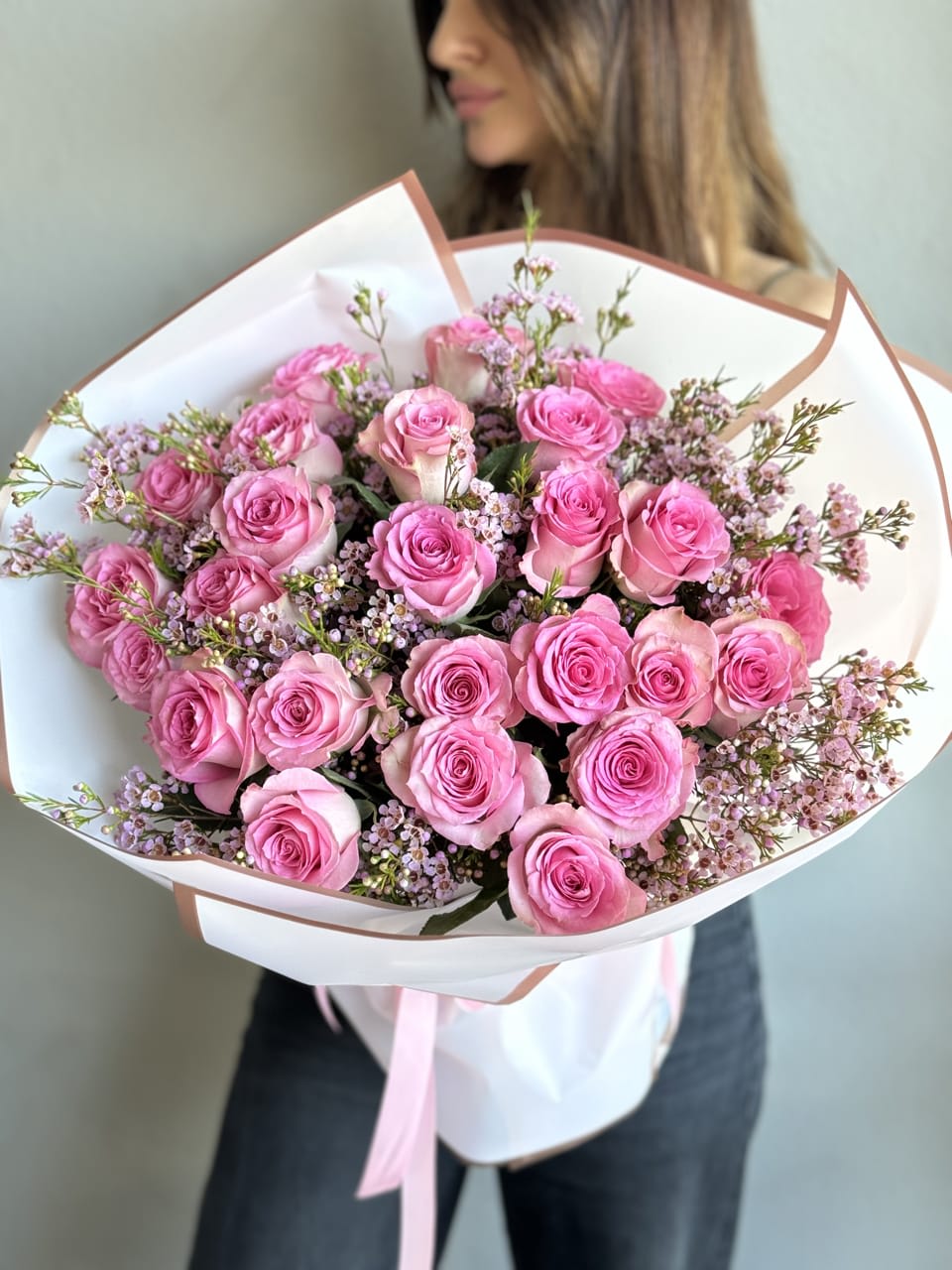Sweet Unique Roses bouquet - An enchanting hand-held bouquet, featuring 25 Sweet Unique Pink Roses, each petal whispering tales of grace and tenderness. Meticulously arranged, this captivating display exudes timeless elegance and charm, perfect for infusing any occasion with romance and beauty.
