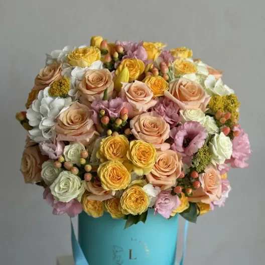 Sunny Delight in a Tiffany color box -  A cheerful arrangement featuring vibrant yellow roses, lush hydrangeas, aromatic coffee beans, and fresh greens, all elegantly presented in a Tiffany-colored box. This radiant bouquet brings a burst of sunshine and joy, perfectly blending beauty and fragrance to brighten up any space.