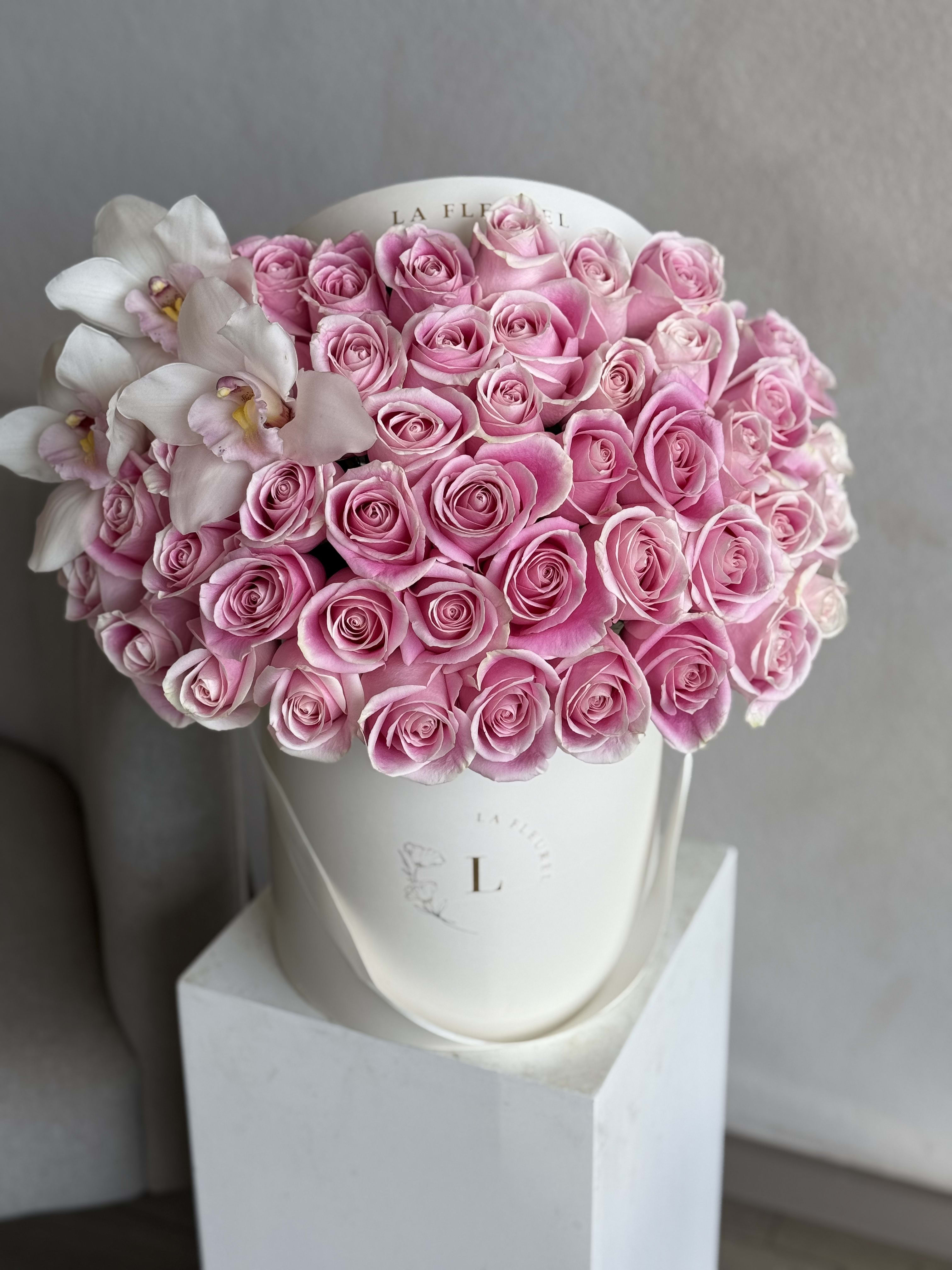 Classic Pink - 50 Roses in a box - This beautiful arrangement filled with the pink roses to deliver your special message to your special someone. Perfect for any occasion. You can choose any color of the box.  Arrangement includes: Medium box  Custom greeting card