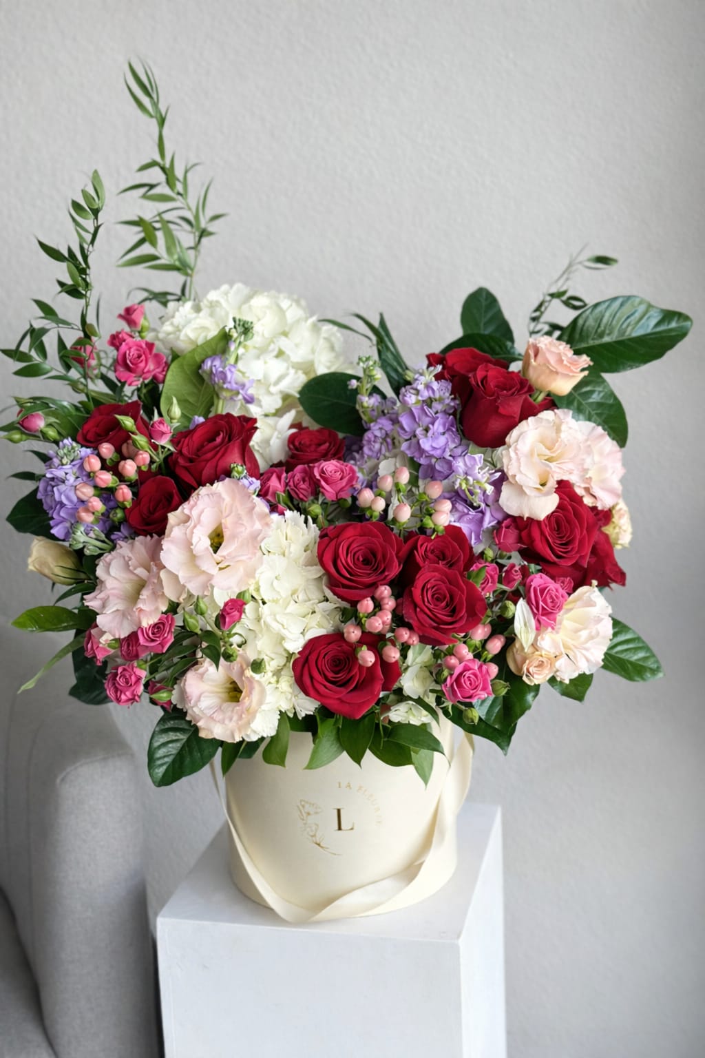 Scarlet Rose Box - An embodiment of passion and elegance, our Scarlet Rose Box is a striking arrangement of deep crimson roses nestled in a captivating red box. This bold yet refined ensemble speaks volumes of love, making it a perfect gesture for special moments or as a statement piece in any space.