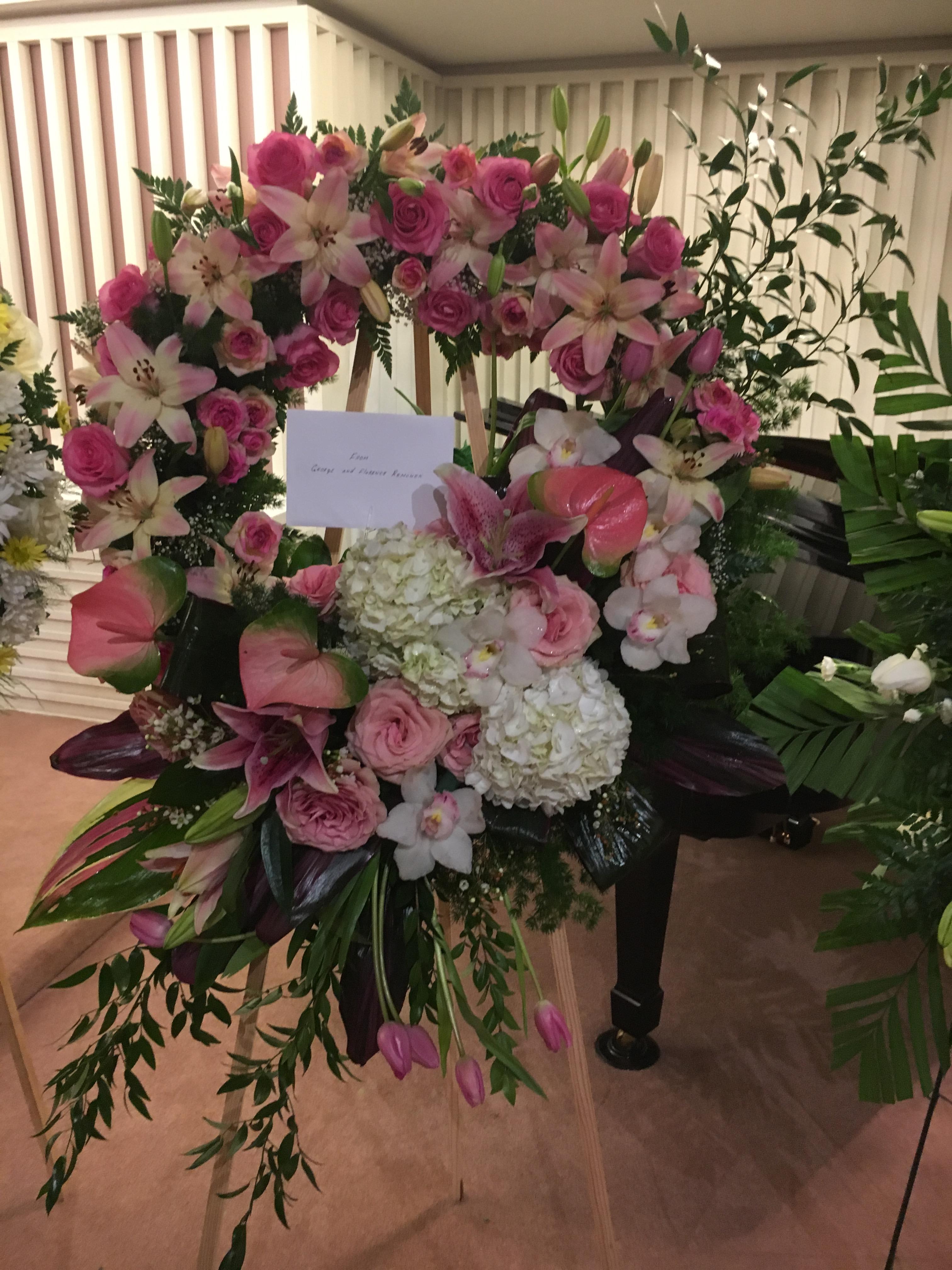 Beautiful Funeral Arrangement Pink flowers,Greens and others in