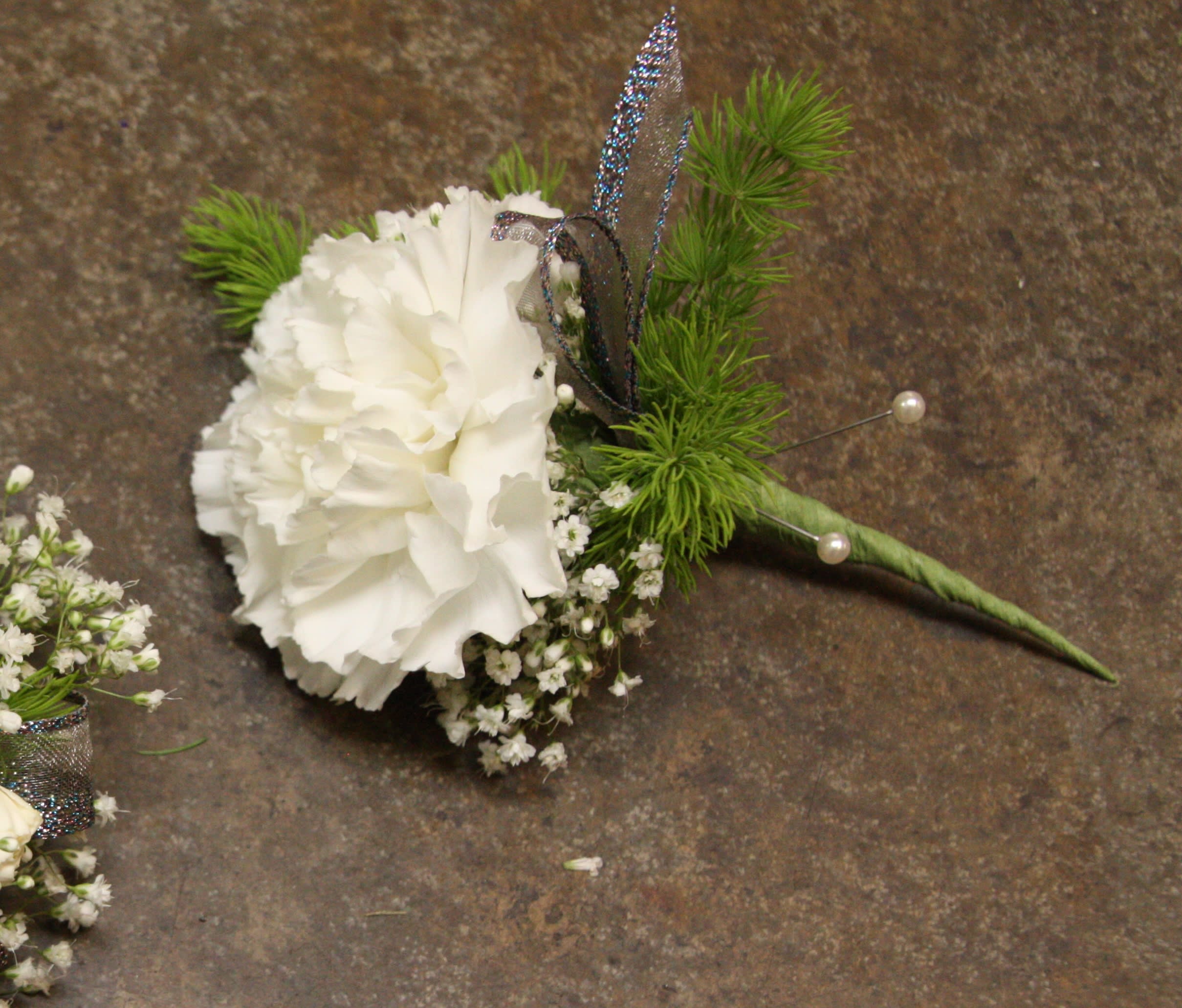 Single White Carnation Boutonniere in Davis, CA Strelitzia Flower Company