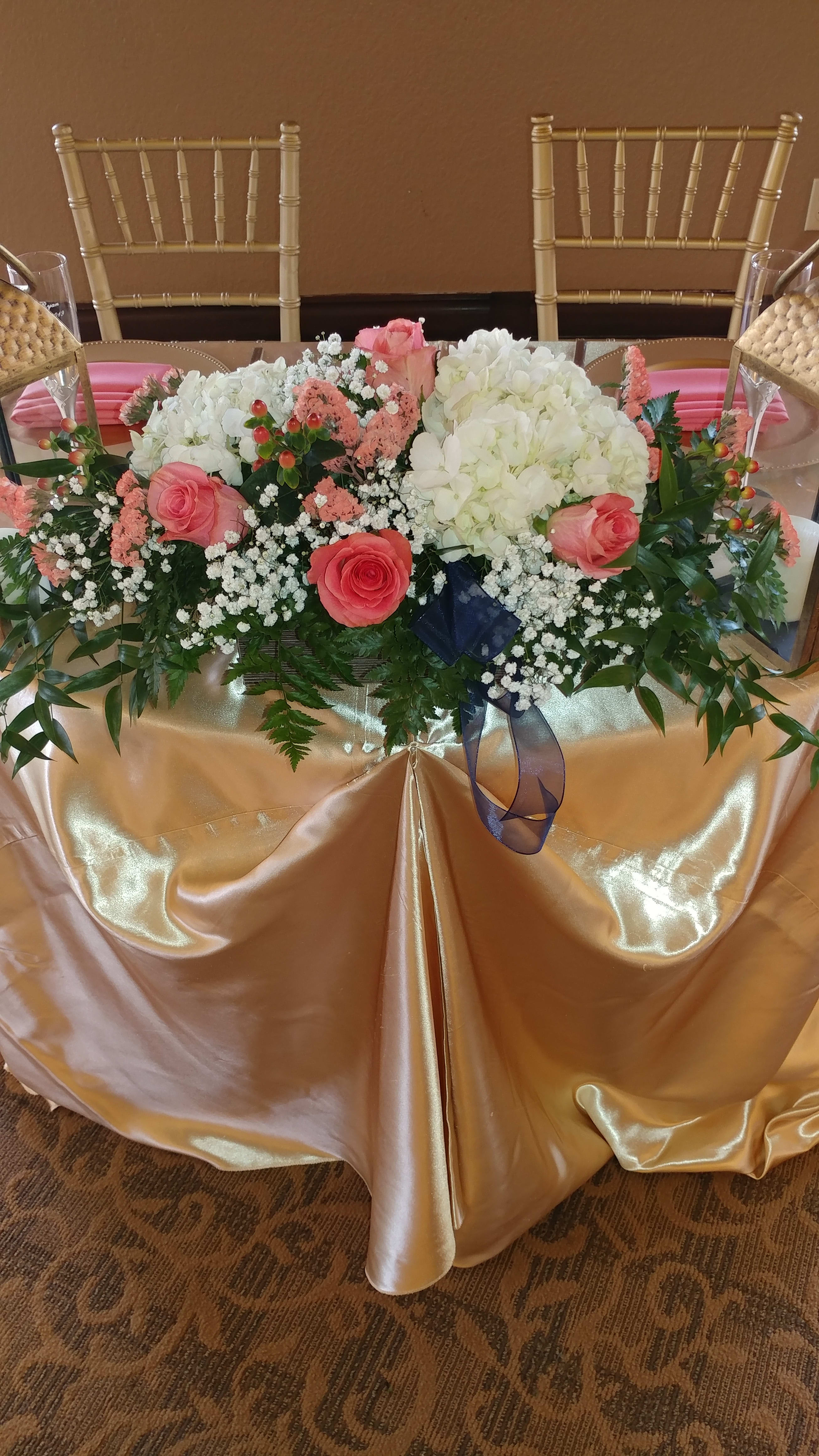 bridesmaids bouquets on head table