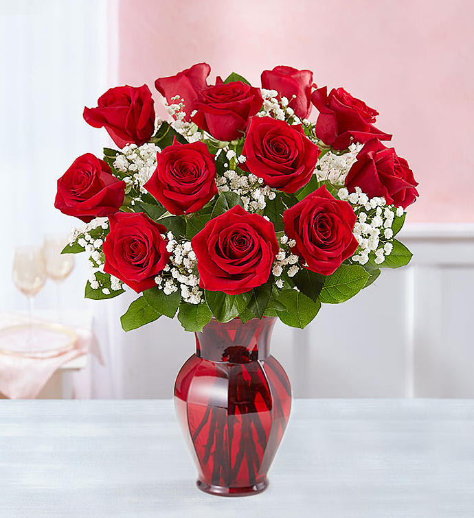 Doz red roses in a ruby red vase in Springfield, IL