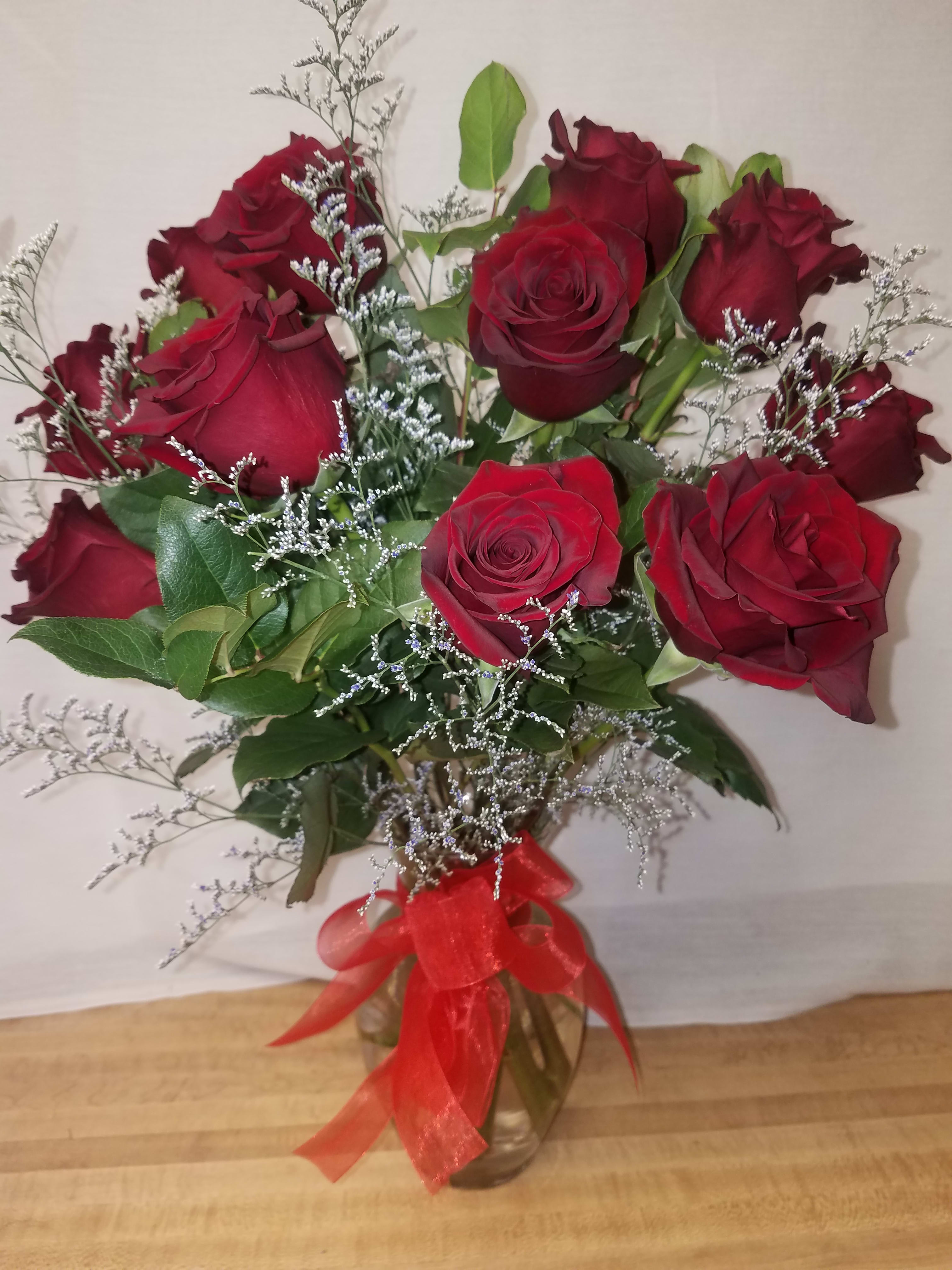 Red roses and limonium in Columbia, PA | Flowers by US