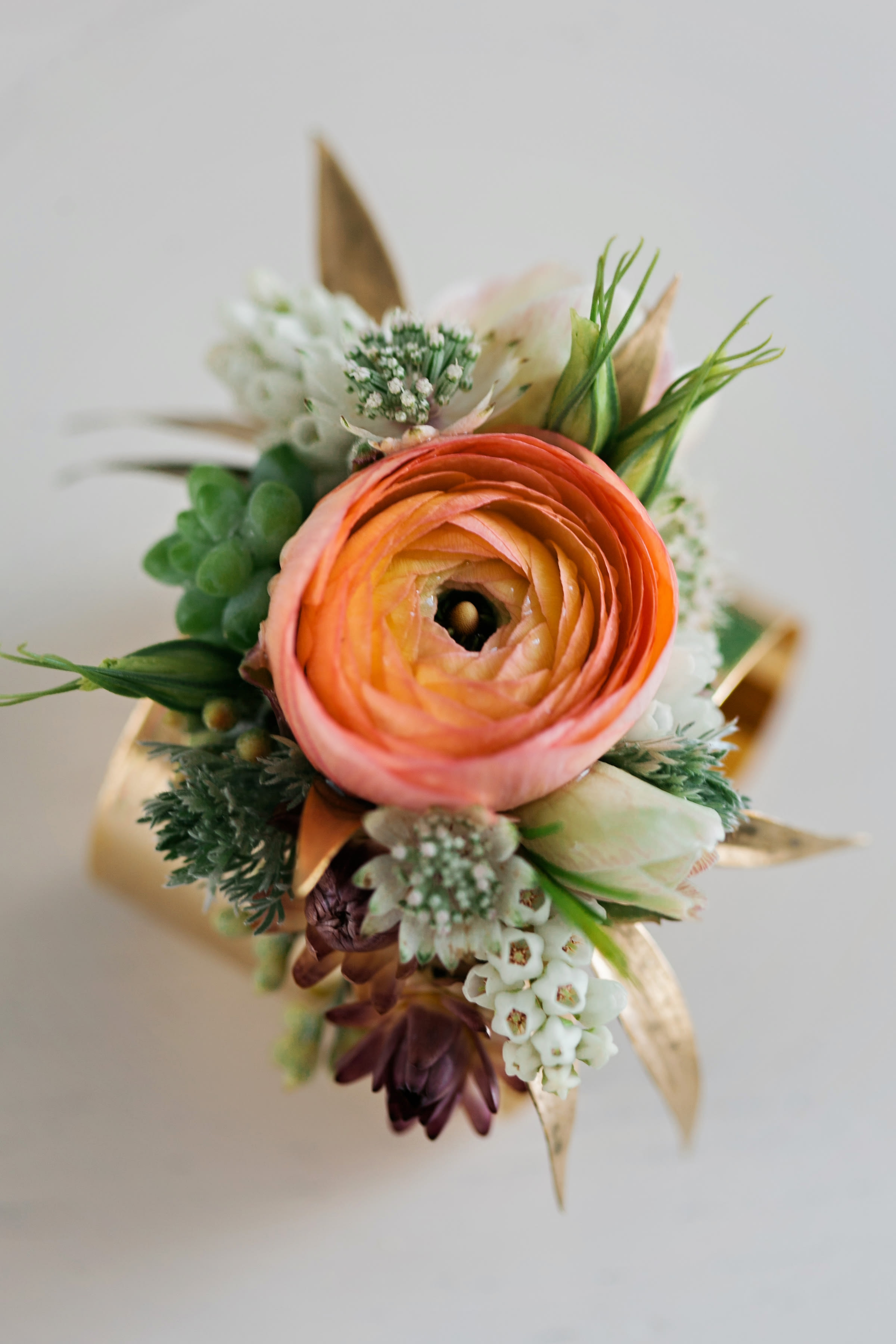 gold cuff corsage