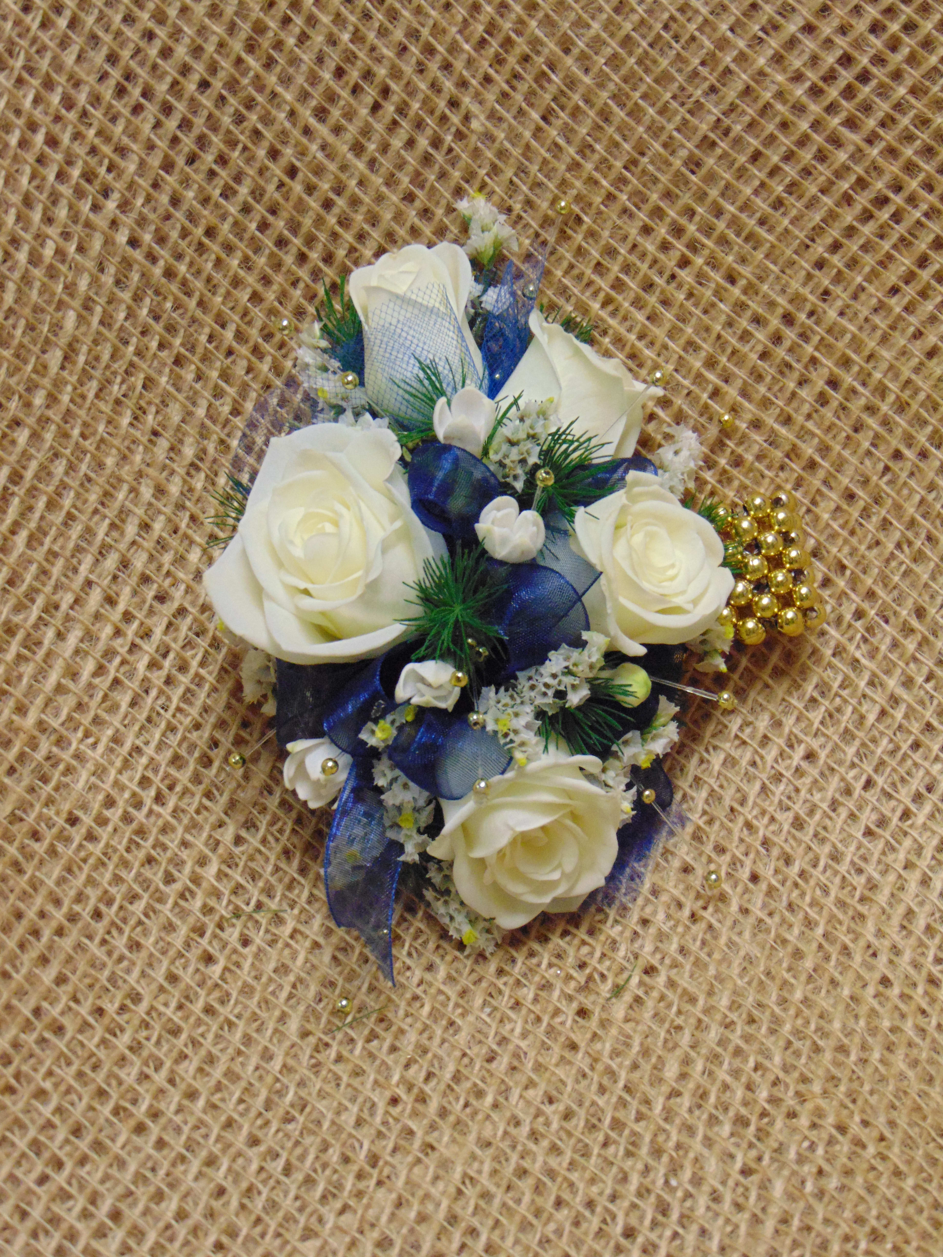 White Rose Wrist Corsage With Royal Blue Gold In Avon Ny Avon Floral World Gift Shoppe The Wedding Florist