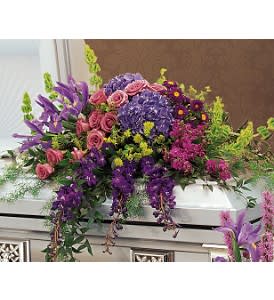 Graceful tribute Casket Cover Graceful tribute Casket Cover - This half-couch casket spray with its gorgeous flowers gracefully comforts your loved ones. One half-couch casket spray features fragrant lavender roses, blue hydrangea, blue iris, hybrid delphinium and soft green foliage accents. Approximately 40" W x 44" H