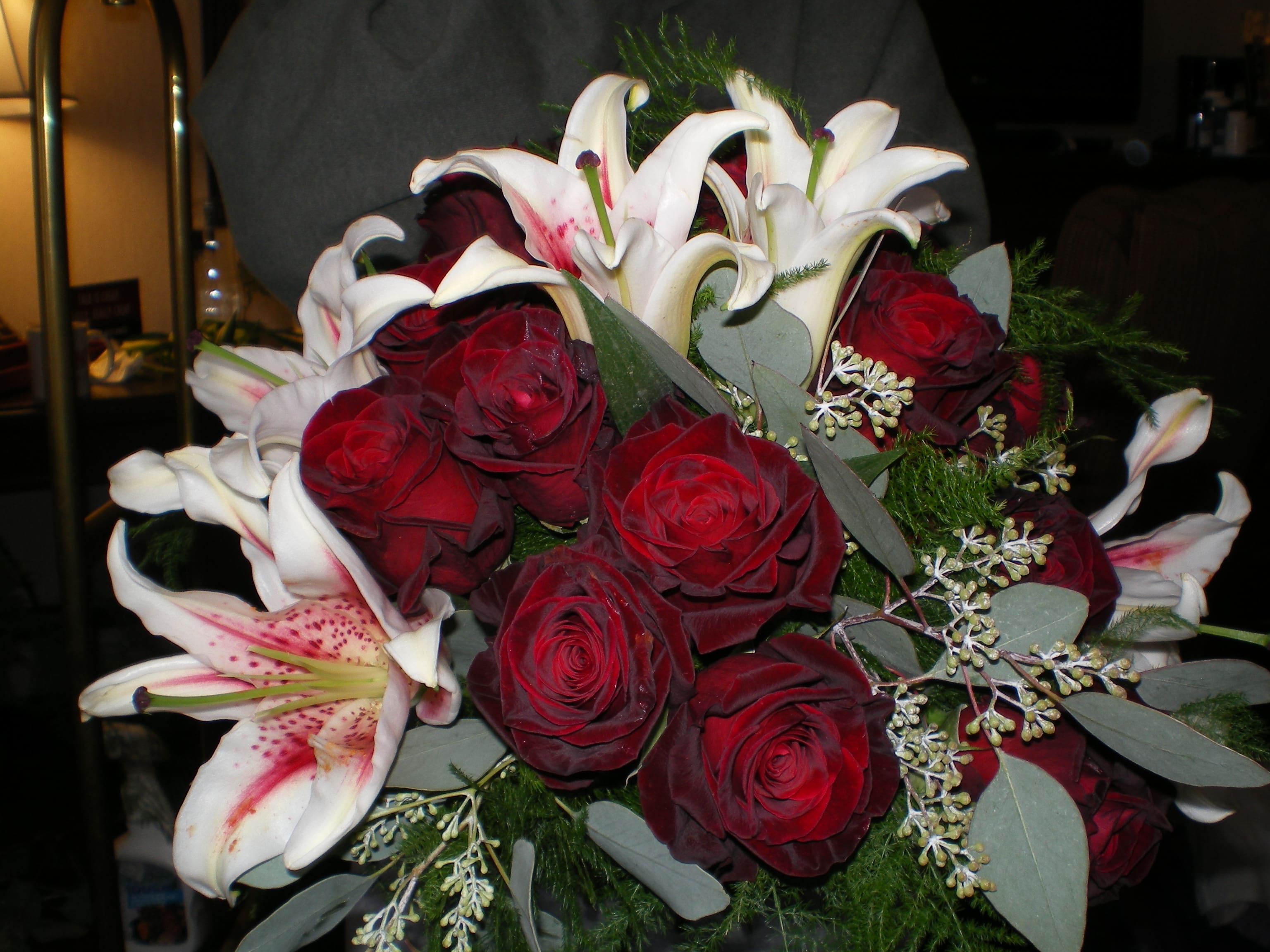 Elegant Evening Wedding Bouquet - black baccara roses and stargazer lilies with textural greenery